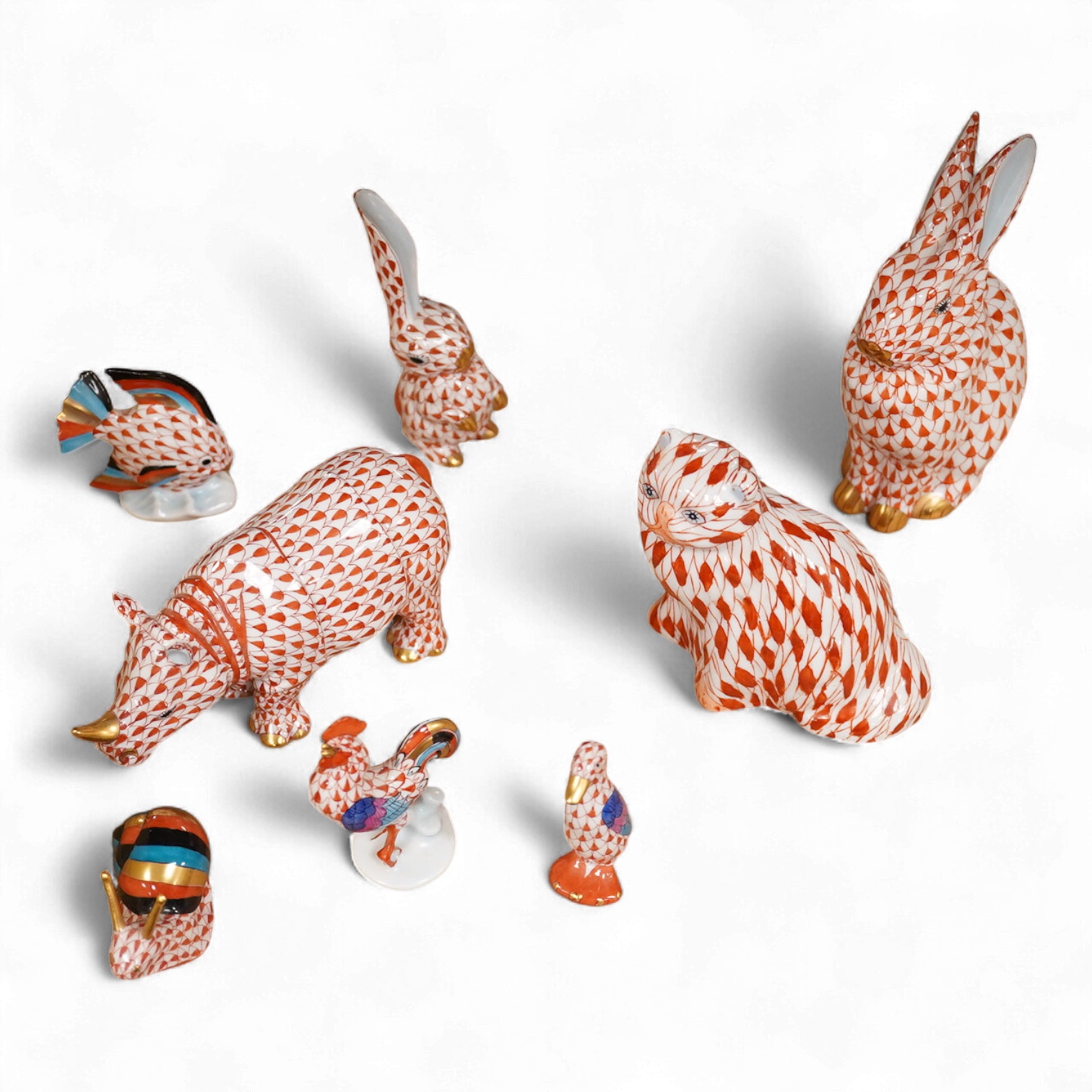 A group of Herend red scale animals and a similar cat, 14cm high